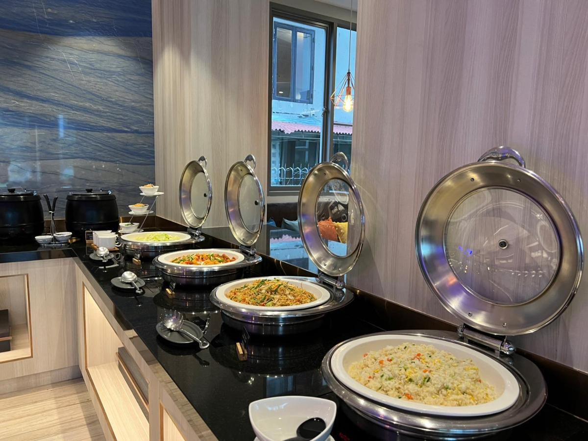 Fifth Pattaya Jomtien By Shiwalai Int Hotel Exterior photo A selection of food at a buffet